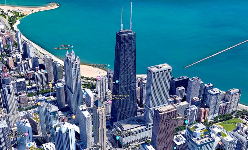 Aerial photo of Chicago's John Hancock Center, a 100-story building with X-shaped braces on the outside. I live on the 54th Floor.